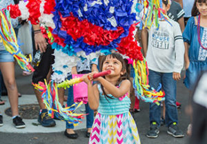 young girl hitting a piñata in Pensacola, FL