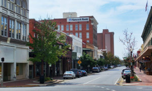 A street in downtown Pensacola, Florida. View of Hancock bank building.