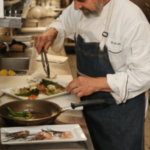 Chef Irv Miller preps lionfish dish, plating veggies